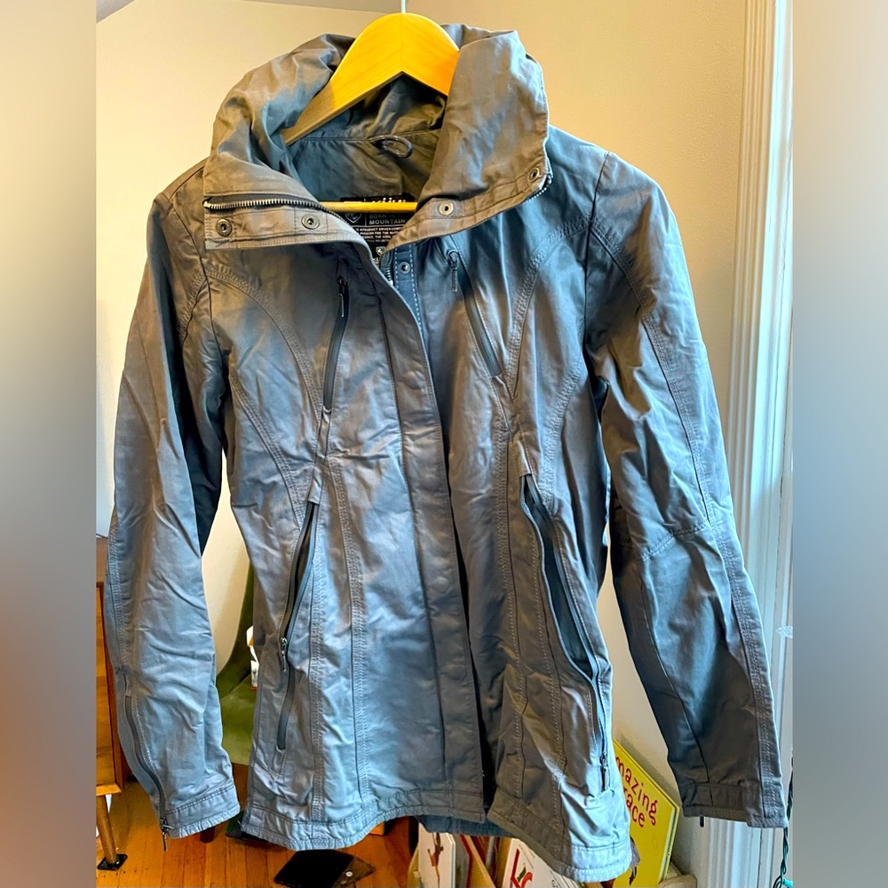 Kuhl women’s jacket. Water resistant. Hood zips into collar.